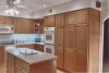Germantown Kitchen Remodel - remodel, renovation, kitchen, kitchen remodel, sink, island, wood flooring, maple cabinets, wall oven, soilid surface counter
