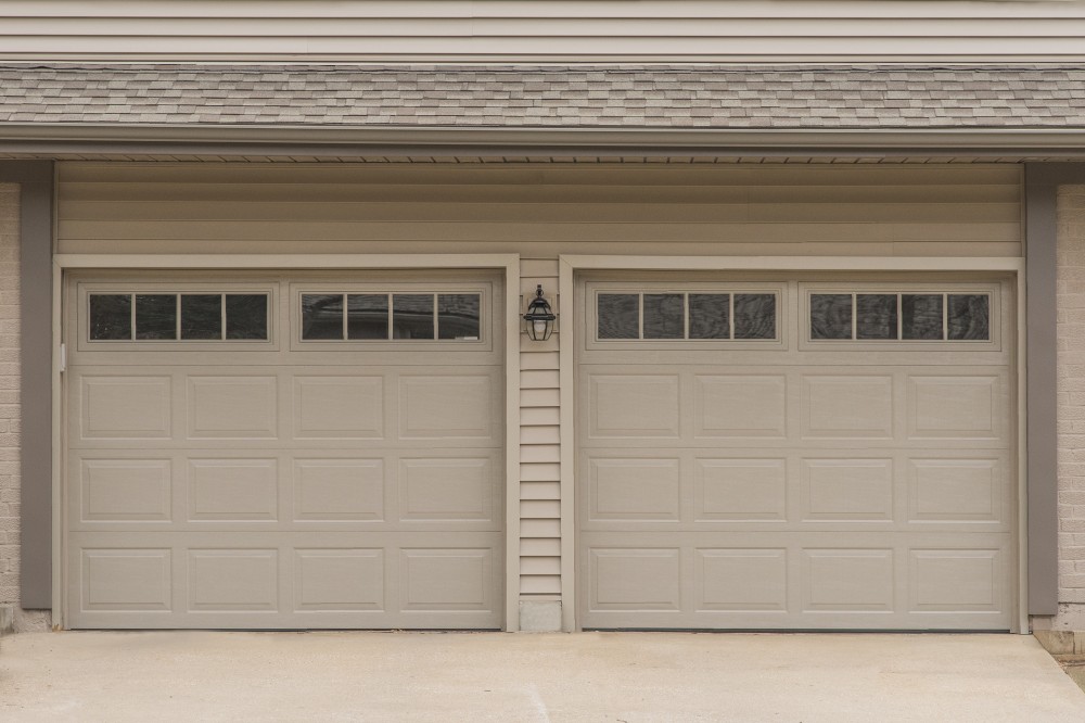 Photo By Johnson County Siding & Window Co.. Carriage Garage Doors