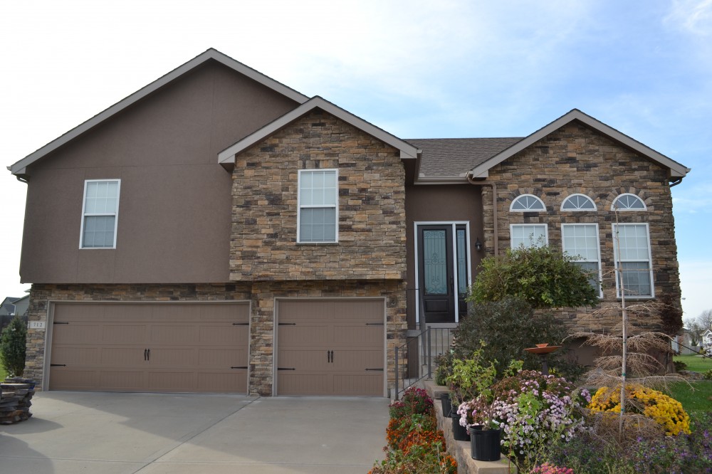 Photo By Johnson County Siding & Window Co.. Carriage Garage Doors