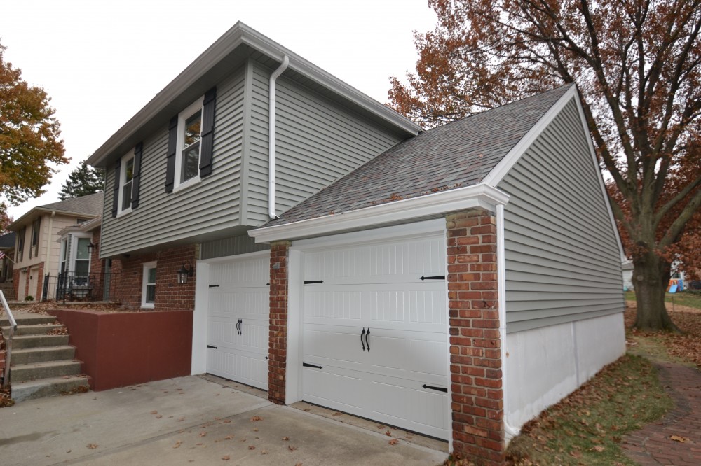 Photo By Johnson County Siding & Window Co.. Carriage Garage Doors