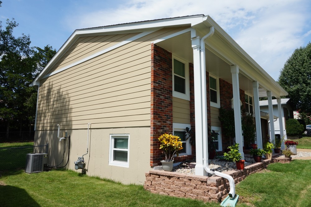 Photo By STL Siding Pros. James Hardie Autumn Tan Siding