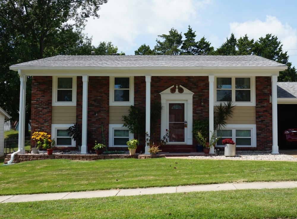 Photo By STL Siding Pros. James Hardie Autumn Tan Siding