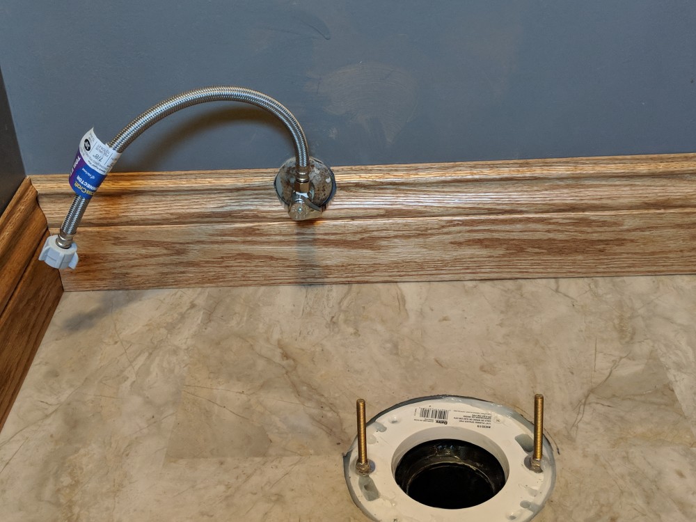 Photo By JL Construction LLC. Bathroom Flooring Remodel