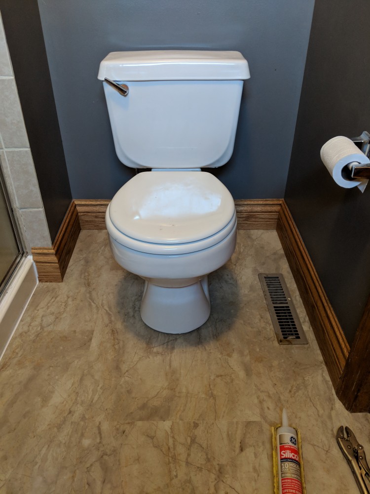 Photo By JL Construction LLC. Bathroom Flooring Remodel