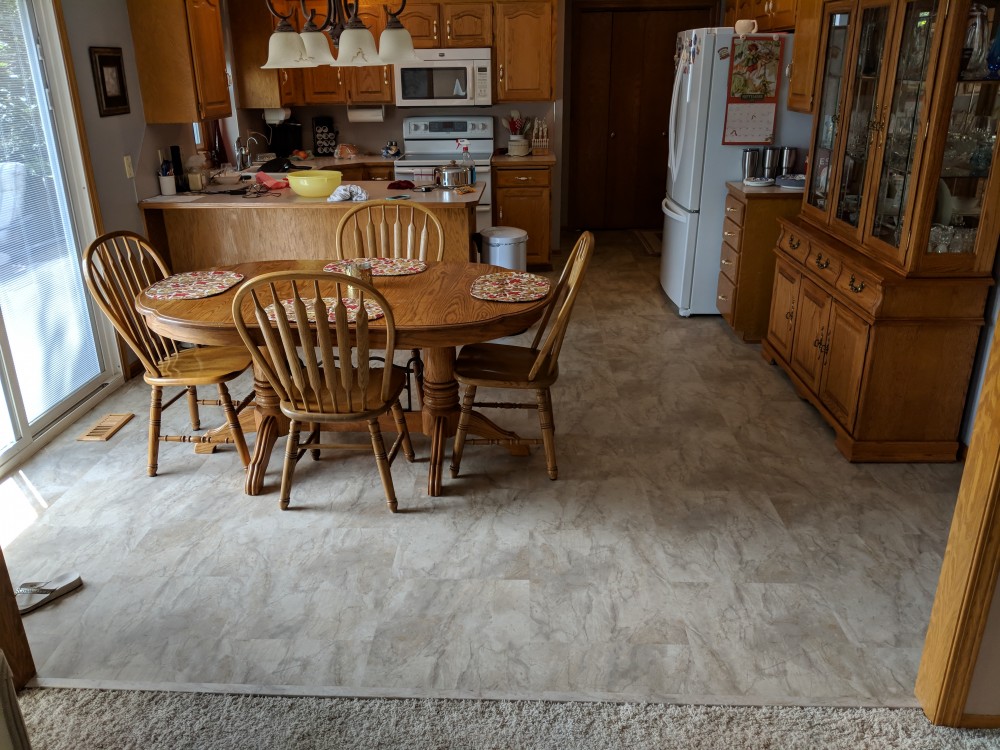 Photo By JL Construction LLC. COREtec Plus Kitchen Remodel 