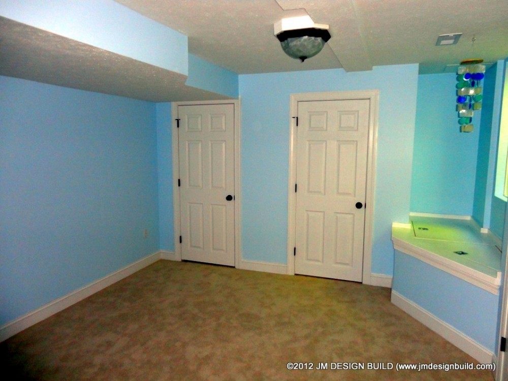 Photo By JM Design Build & Remodeling. Basement Finishing Richfield, OH