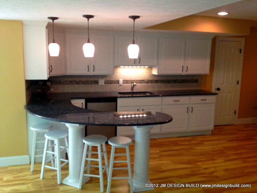 Photo By JM Design Build & Remodeling. Basement Finishing Richfield, OH