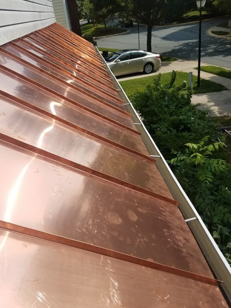 Photo By BRAX Roofing. Copper Standing Seam Roof Replacement 