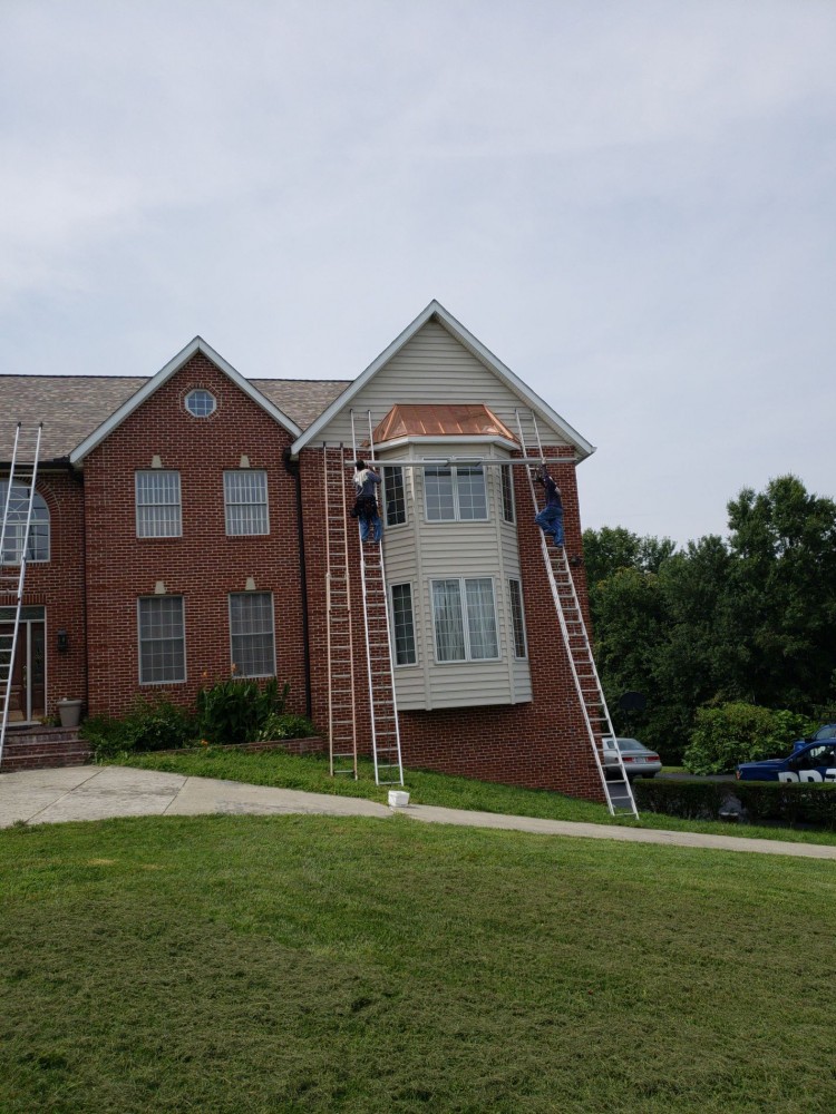 Photo By BRAX Roofing. Copper Standing Seam Bay Window 