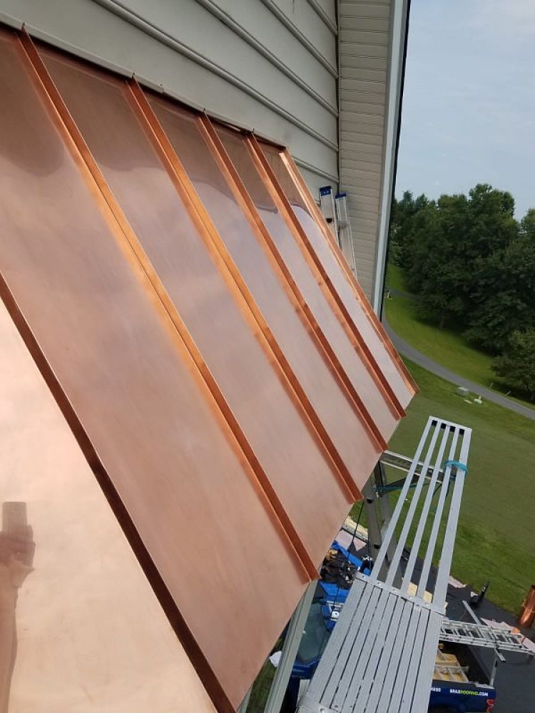 Photo By BRAX Roofing. Copper Standing Seam Bay Window 