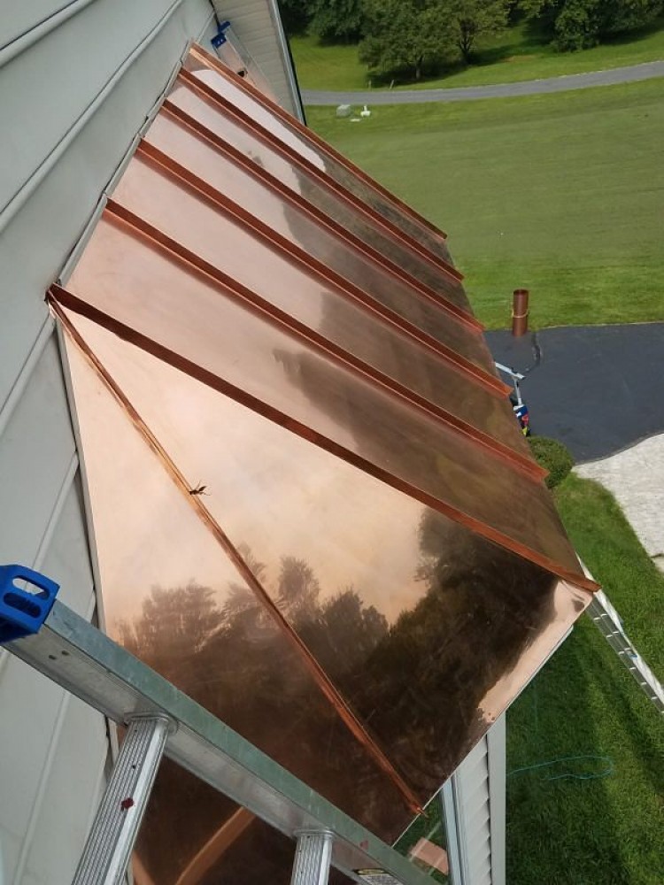 Photo By BRAX Roofing. Copper Standing Seam Bay Window 