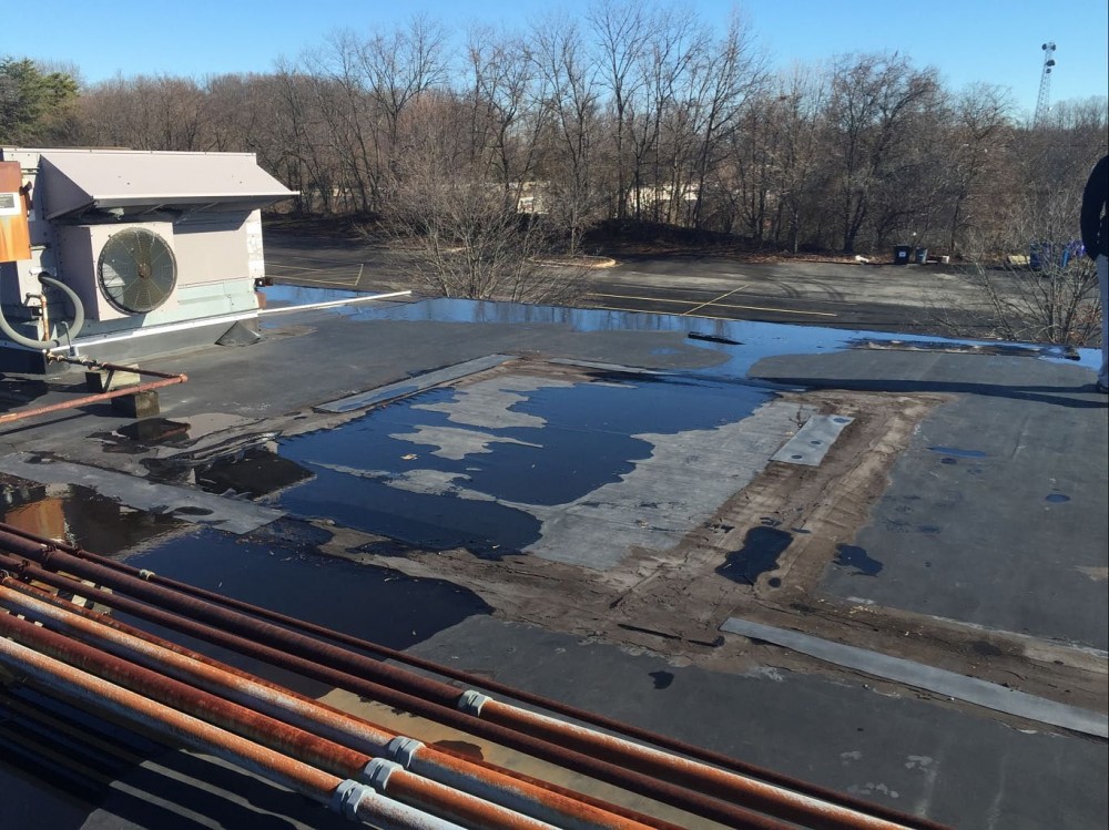Photo By BRAX Roofing. New Silicone Roof Coating For Flat Roof. 