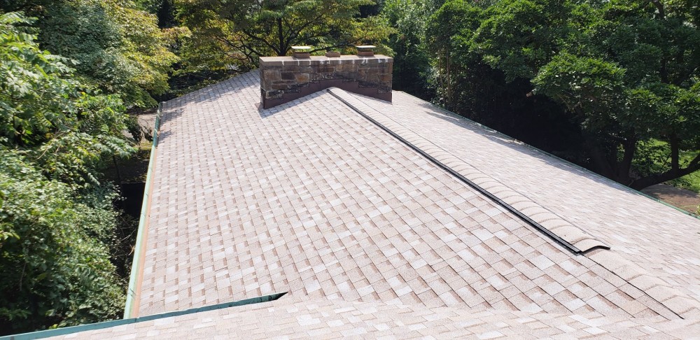 Photo By BRAX Roofing. Installing New Ridge Vents