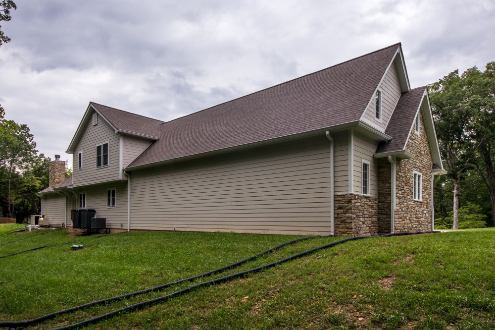 Photo By STL Siding Pros. Cobblestone James Hardie Siding With Arctic White Trim