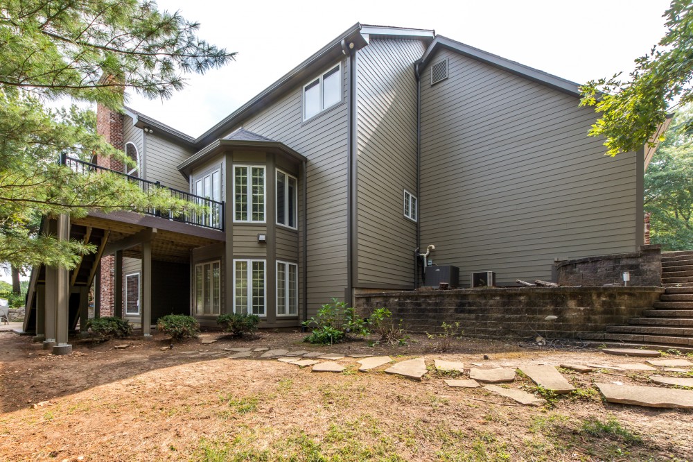 Photo By STL Siding Pros. James Hardie Woodstock Brown Siding With Woodstock Brown Trim