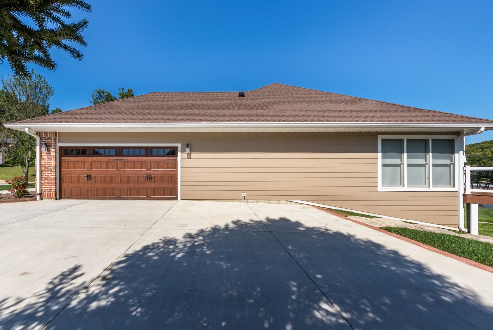 Photo By STL Siding Pros. Khaki Brown James Hardie Siding 