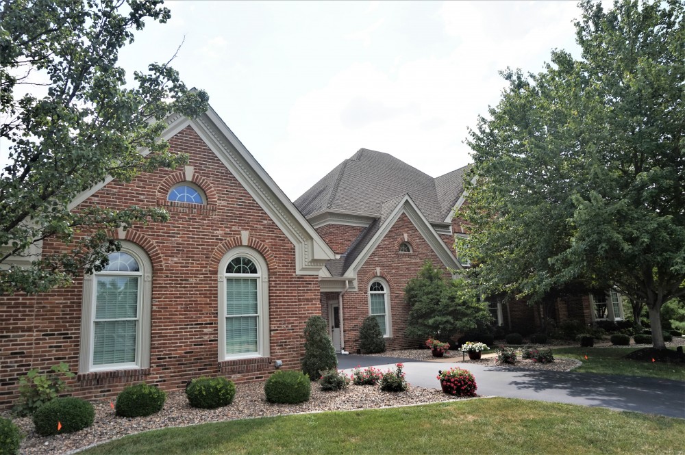 Photo By STL Siding Pros. Cobblestone James Hardie Siding With Arctic White Trim