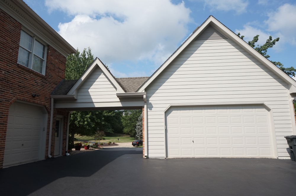 Photo By STL Siding Pros. Cobblestone James Hardie Siding With Arctic White Trim
