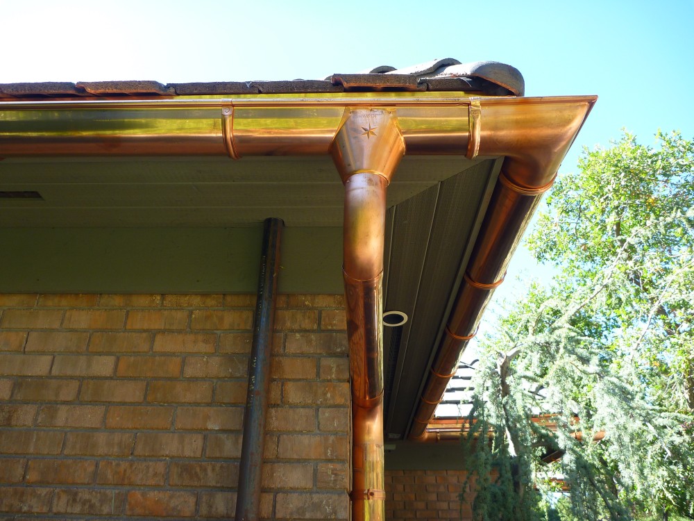 Photo By RGS Exteriors. Custom Copper 1/2 Round