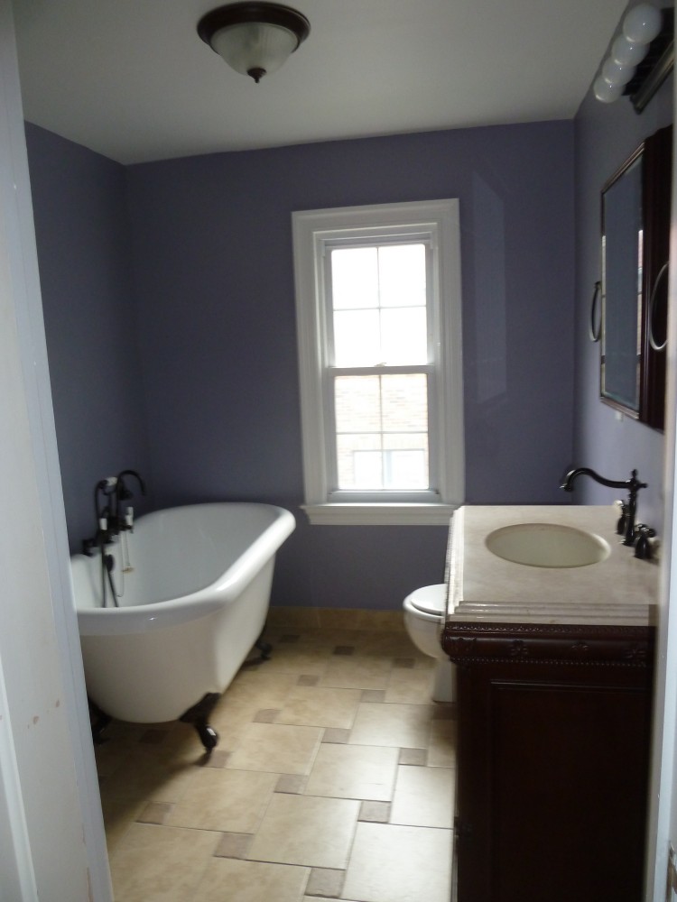 Photo By Petersen Cor Associates, LLC. Bathrooms