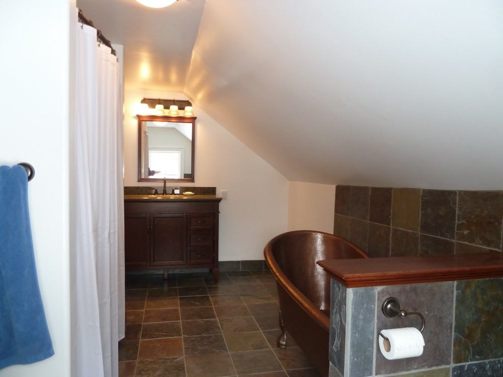 Photo By Petersen Cor Associates, LLC. Bathrooms