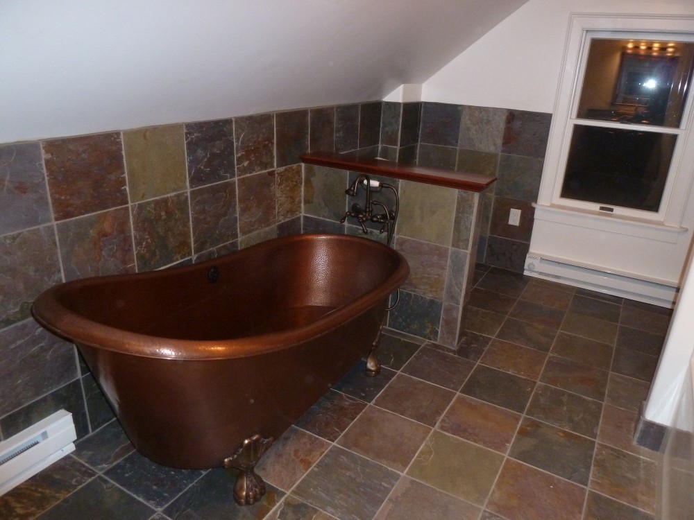 Photo By Petersen Cor Associates, LLC. Bathrooms