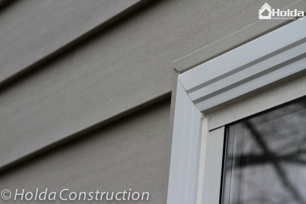 Photo By Holda Construction. Insulated Siding ,Windows Clad