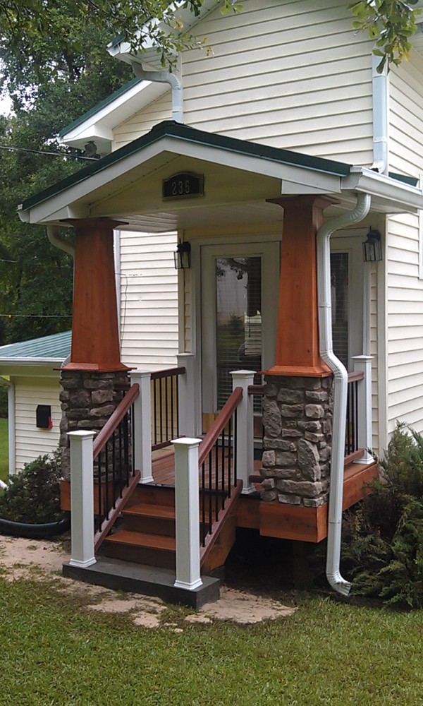 Photo By All American Exteriors. Timbertech Decking, Rails, Stone & Cedar Columns