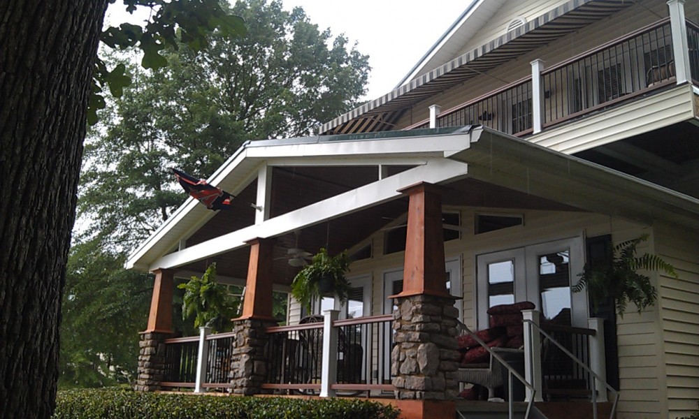 Photo By All American Exteriors. Timbertech Decking, Rails, Stone & Cedar Columns