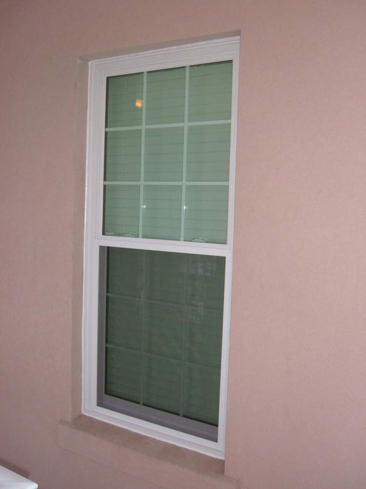 Photo By Siding Industries. HURRICANE IMPACT WINDOWS