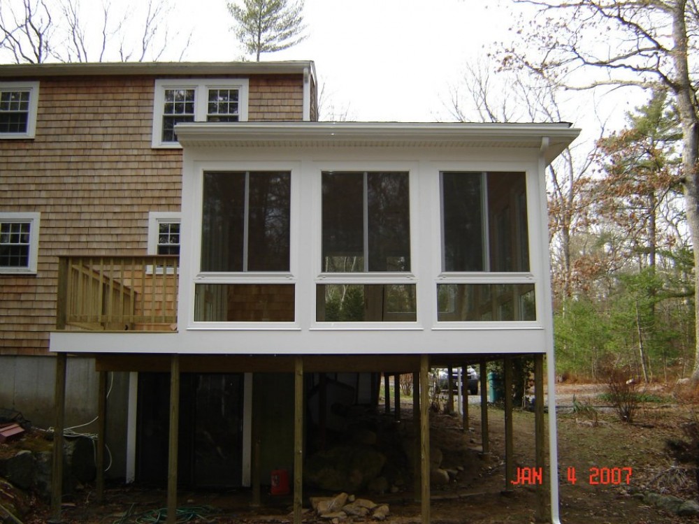 Photo By Care Free Homes Inc.. Sunroom - Before & After