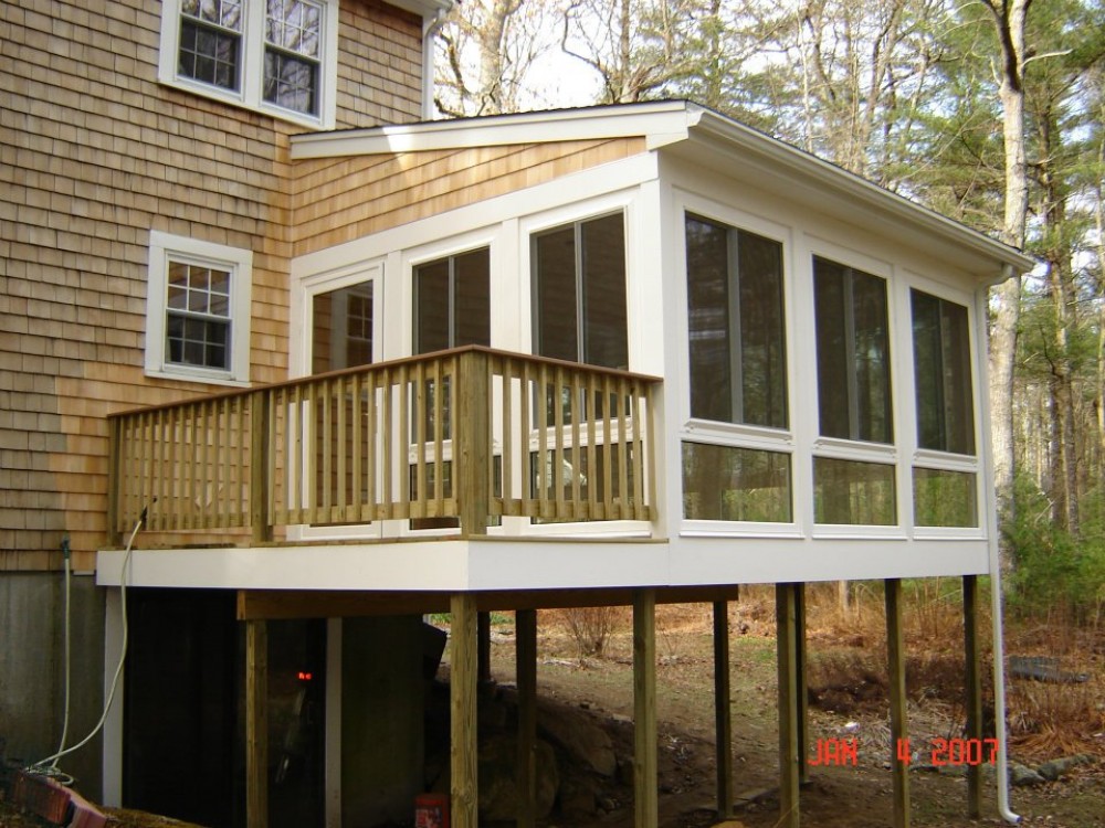 Photo By Care Free Homes Inc.. Sunroom - Before & After