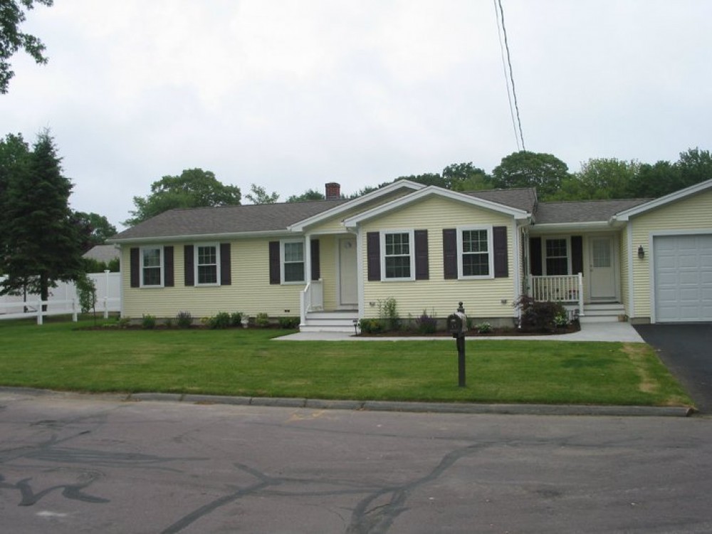 Photo By Care Free Homes Inc.. Vinyl Siding & Kitchen Remodel - Before & After