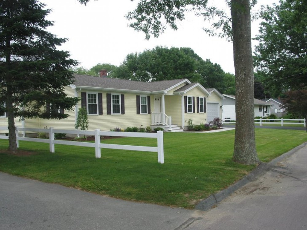 Photo By Care Free Homes Inc.. Vinyl Siding & Kitchen Remodel - Before & After