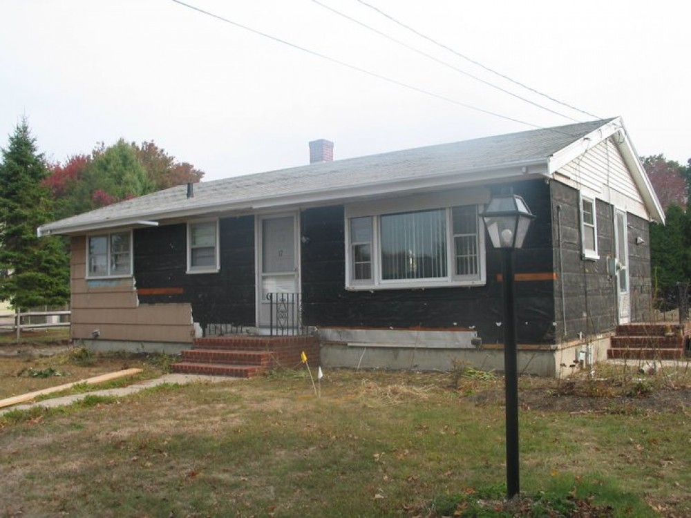Photo By Care Free Homes Inc.. Vinyl Siding & Kitchen Remodel - Before & After