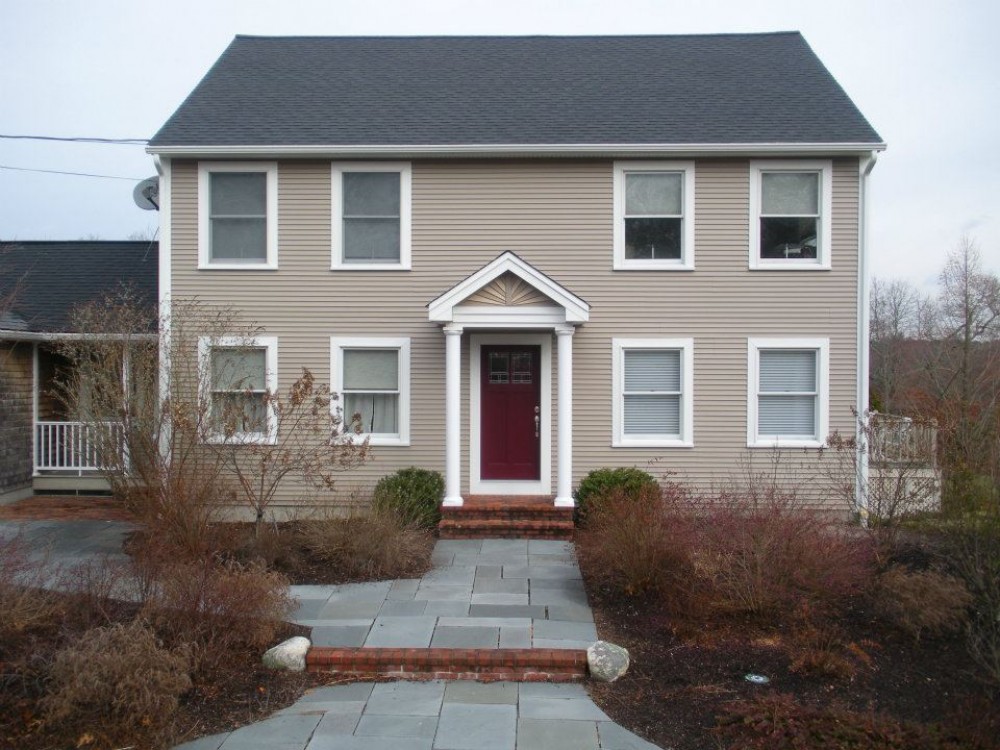 Photo By Care Free Homes Inc.. Vinyl Siding Before & After