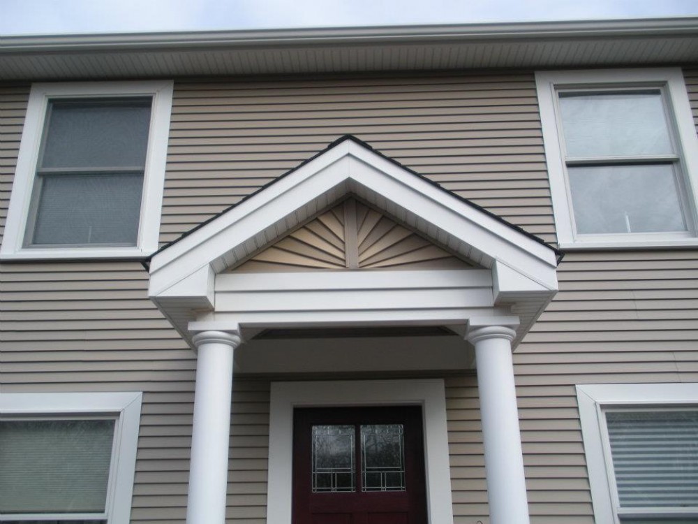 Photo By Care Free Homes Inc.. Vinyl Siding Before & After