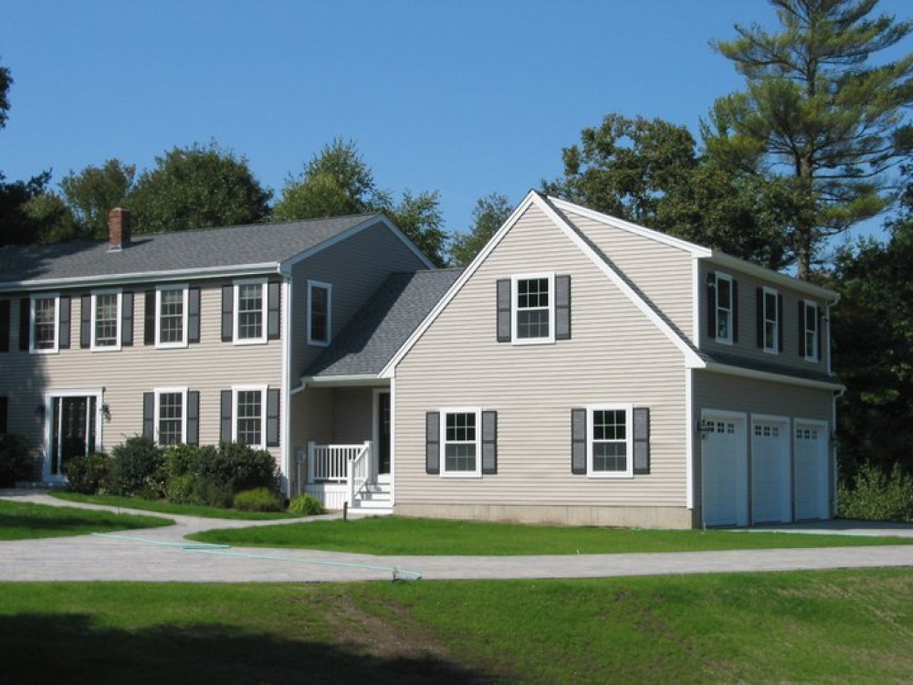 Photo By Care Free Homes Inc.. 3 Car Garage Addition - Before & After