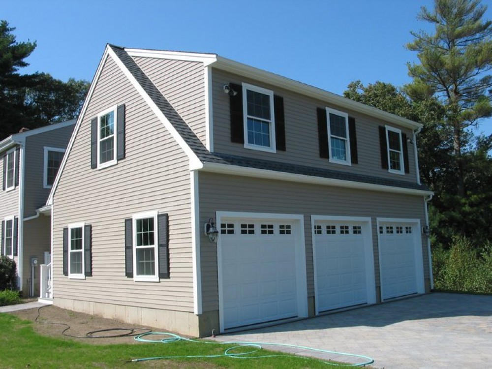 Photo By Care Free Homes Inc.. 3 Car Garage Addition - Before & After
