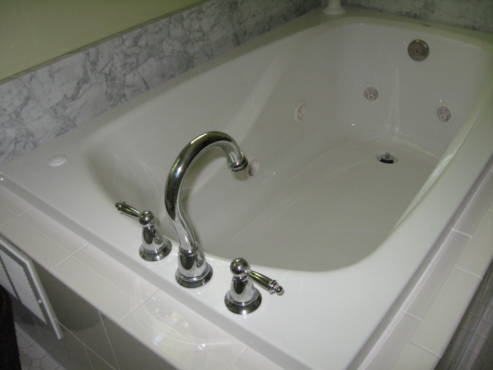 Photo By Designing Home Inc.. Master Bathroom