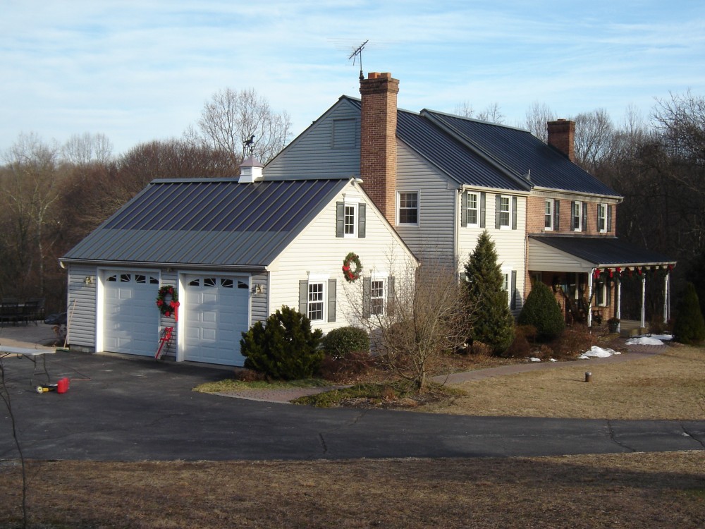 Photo By Global Home Improvement. Metal Solar Roofing