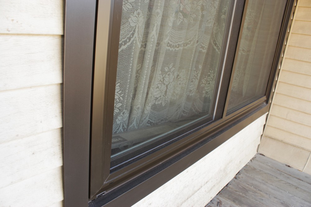 Photo By Custom Concepts Construction. Mezzo Vinyl Windows - Bronze