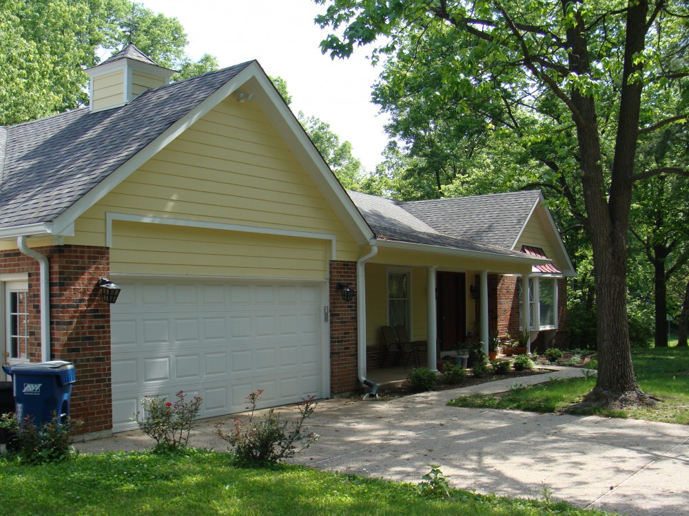 Photo By STL Siding Pros. Woodland Cream James Hardie Siding