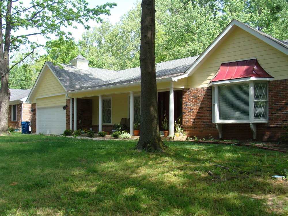 Photo By STL Siding Pros. Woodland Cream James Hardie Siding