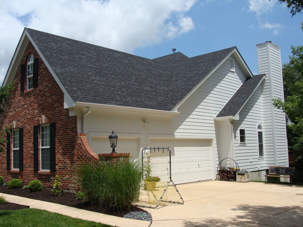 Photo By STL Siding Pros. Arctic White James Hardie Siding