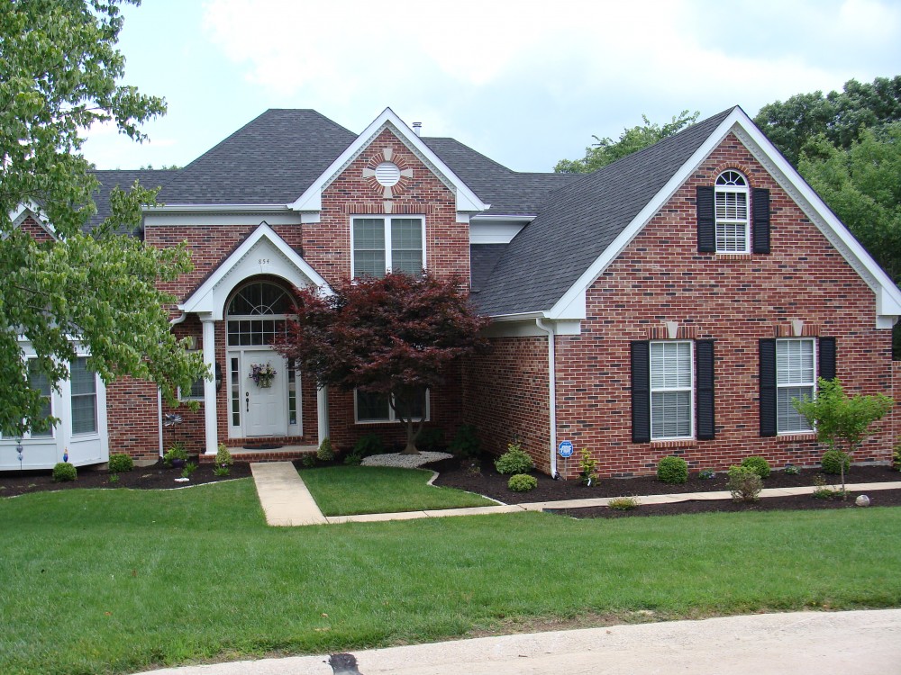 Photo By STL Siding Pros. Arctic White James Hardie Siding