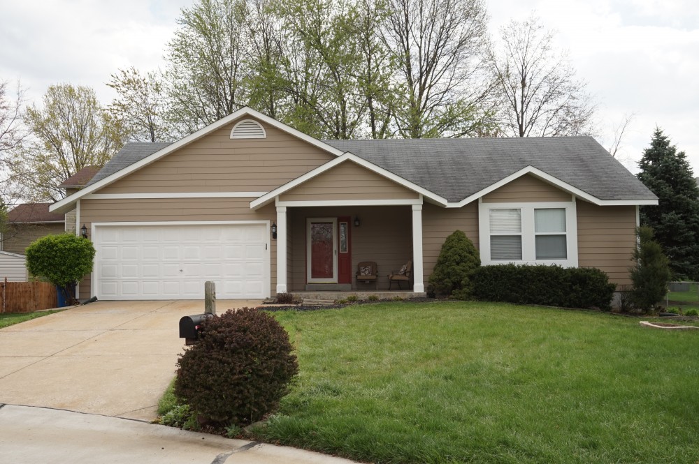 Photo By STL Siding Pros. Khaki Brown James Hardie Siding