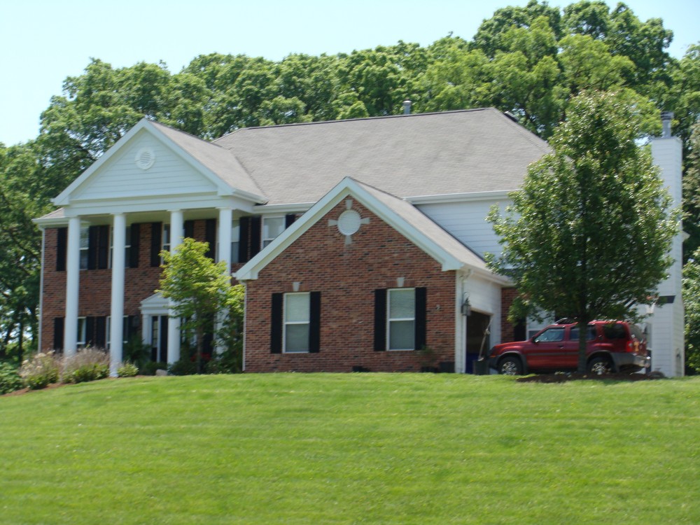 Photo By STL Siding Pros. Arctic White James Hardie Siding