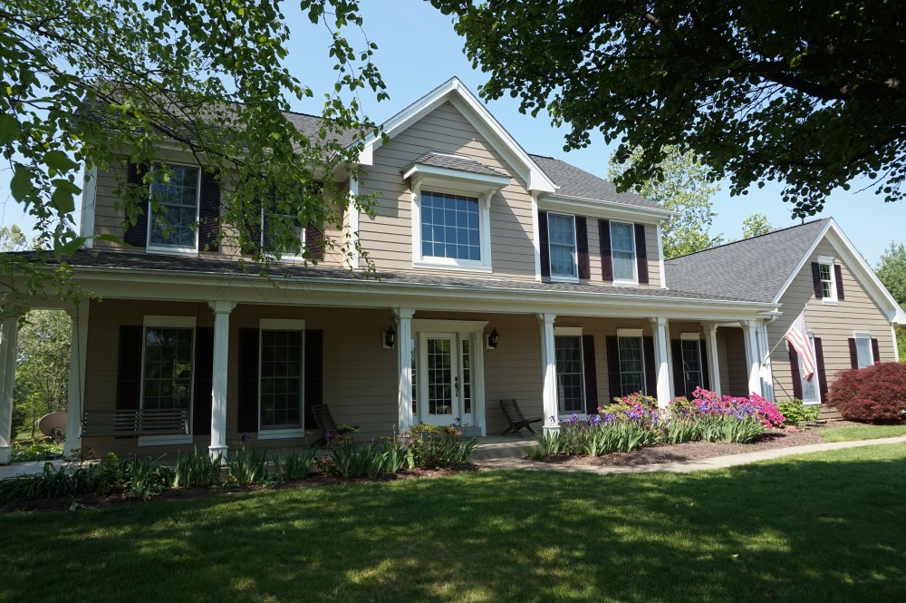 Photo By STL Siding Pros. Khaki Brown James Hardie Siding