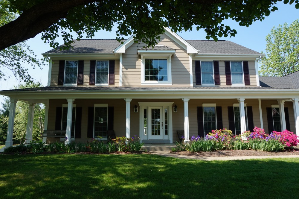 Photo By STL Siding Pros. Khaki Brown James Hardie Siding